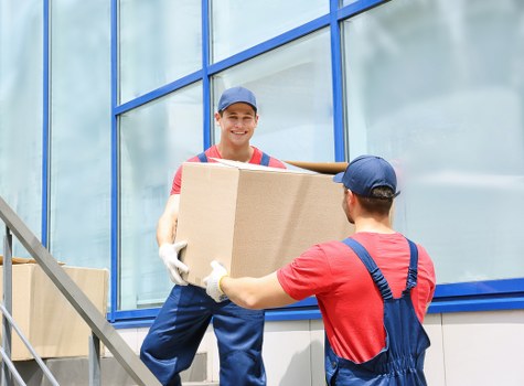 Staff safely handling storage items inside Ickenham Storage facility