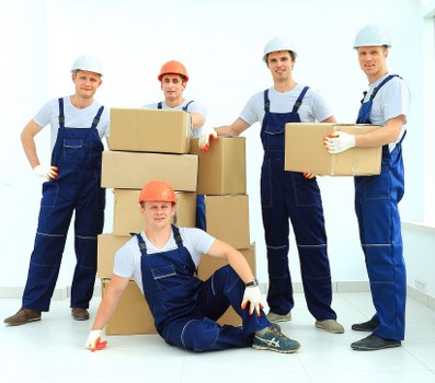 Worker using proper manual handling technique with a storage item