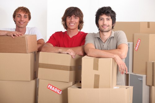 Loading household items into a van for transport in Ickenham