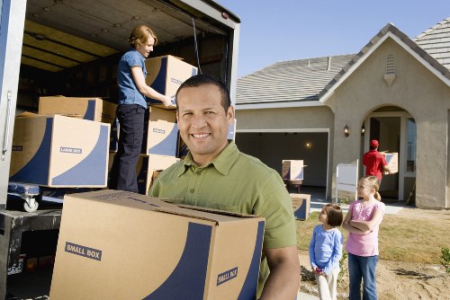 Packed boxes and furniture prepared for small removals